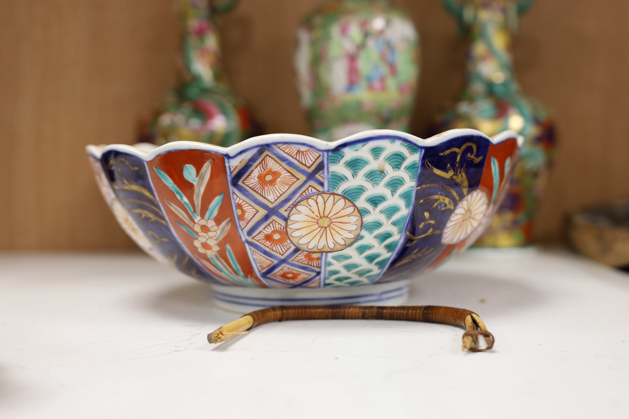 A Chinese overlaid glass snuff bottle, together with a Chinese famille rose vase converted into a lamp, together with, a fish brush holder, a Japanese painted ceramic duck, and other items, tallest 29cm